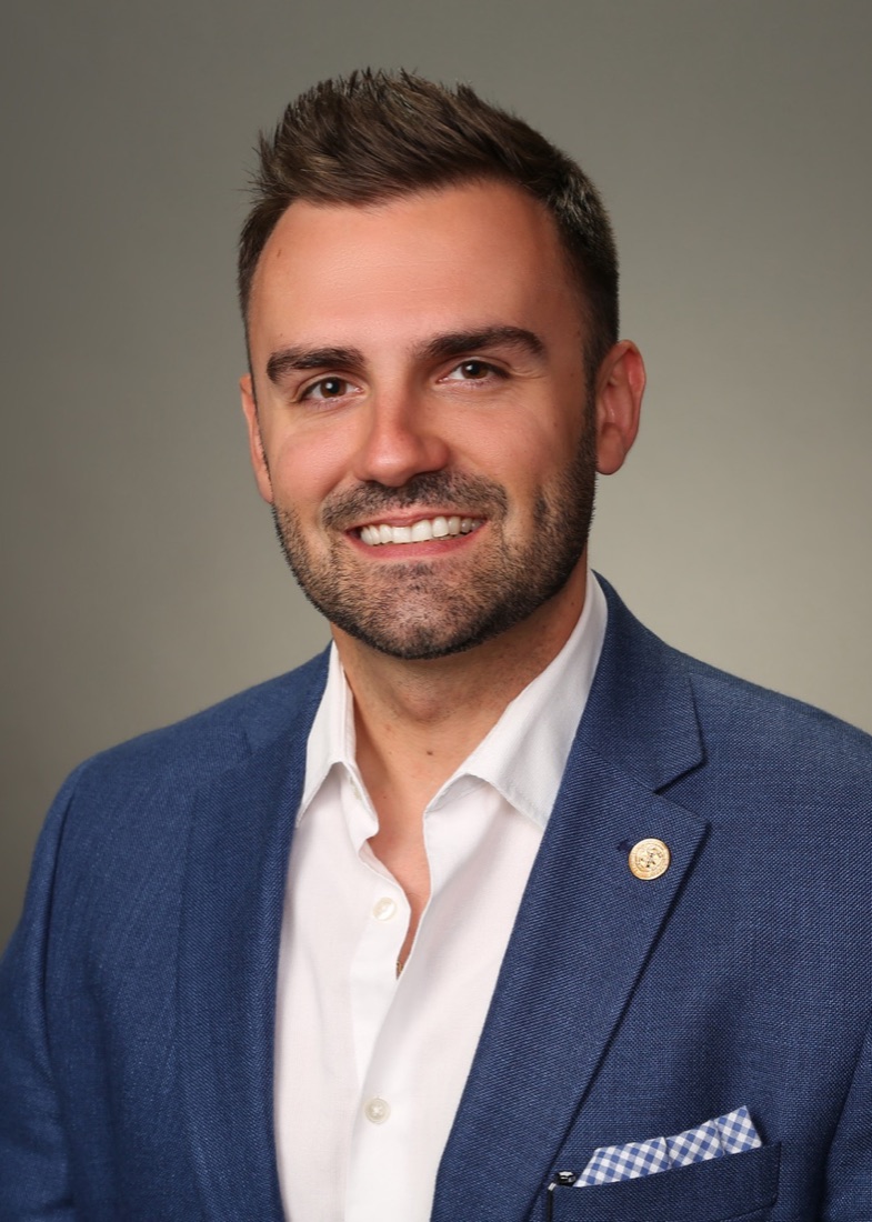 Brandon S. Arlington in a navy blazer